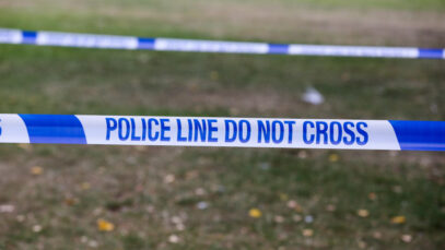 Police tape with ‘Police Line Do Not Cross’ written on it